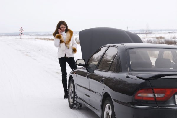 Woman waiting for roadside assistance