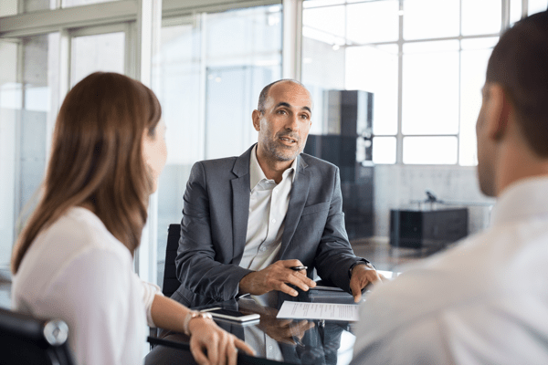 couple talking with a life insurance agent