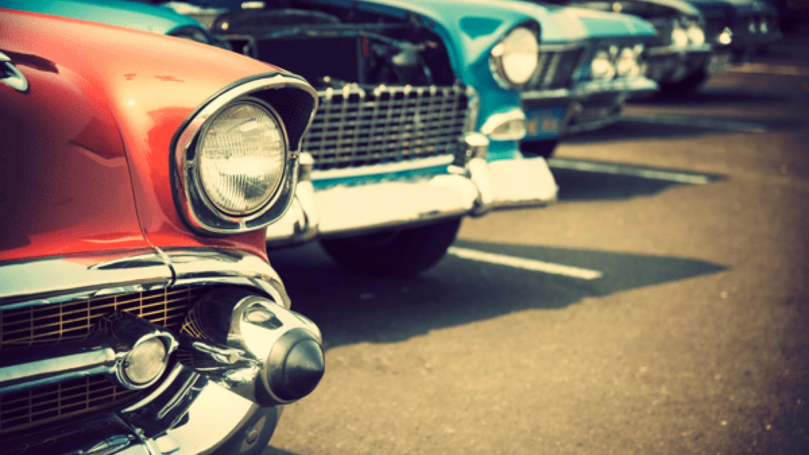 Line of classic cars in a parking lot
