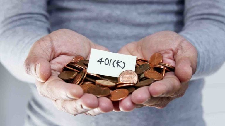 Hands holding 401(k) savings