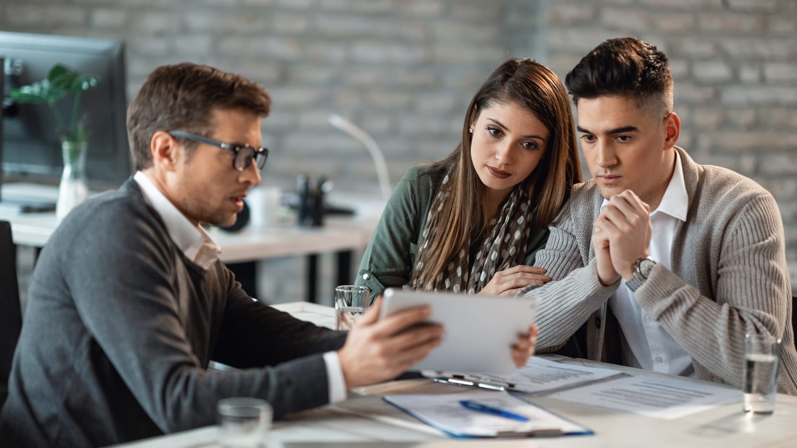 Couple meeting with their insurance agent