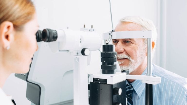 Older man getting an eye exam