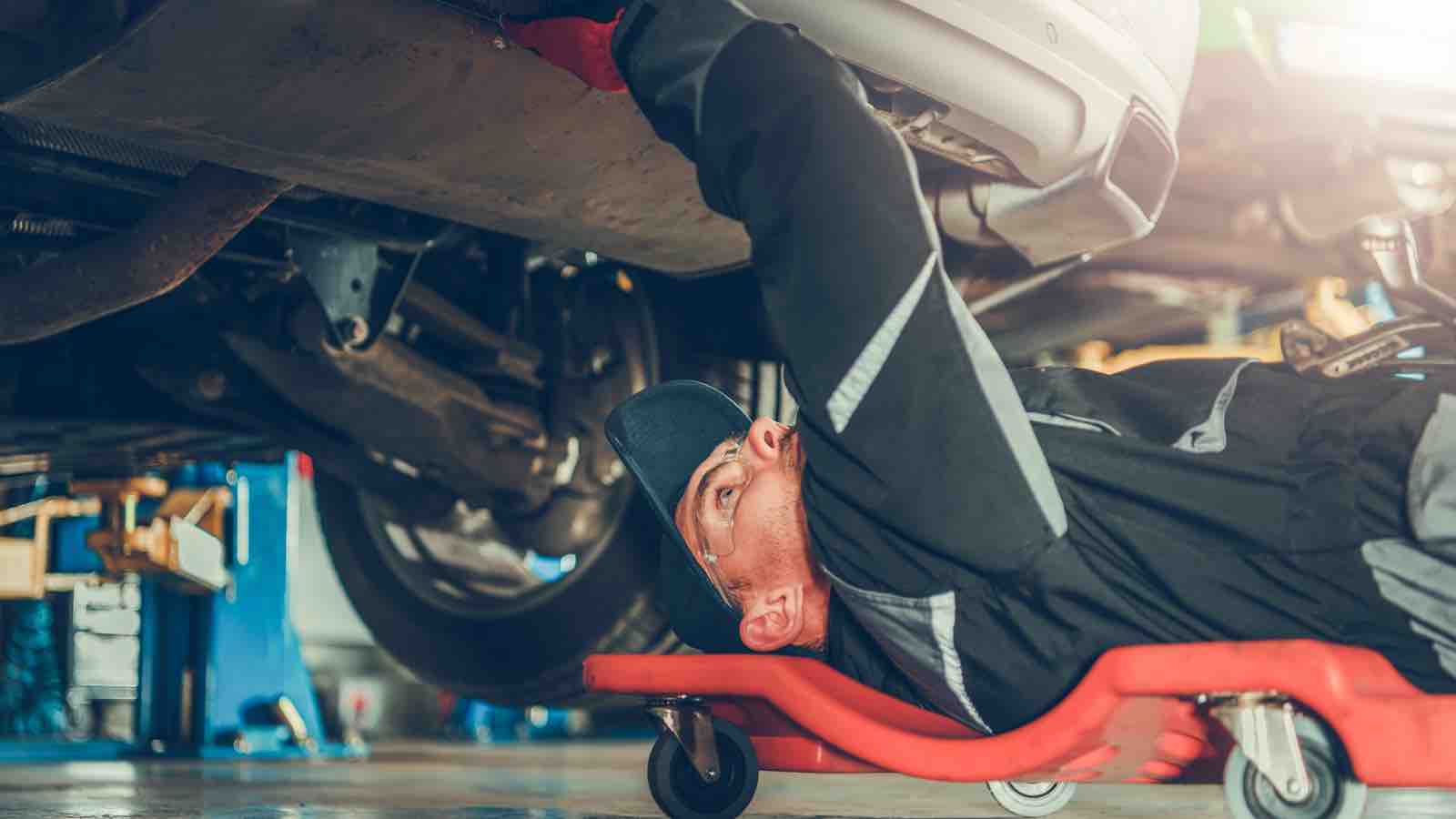 Mechanic working under a car