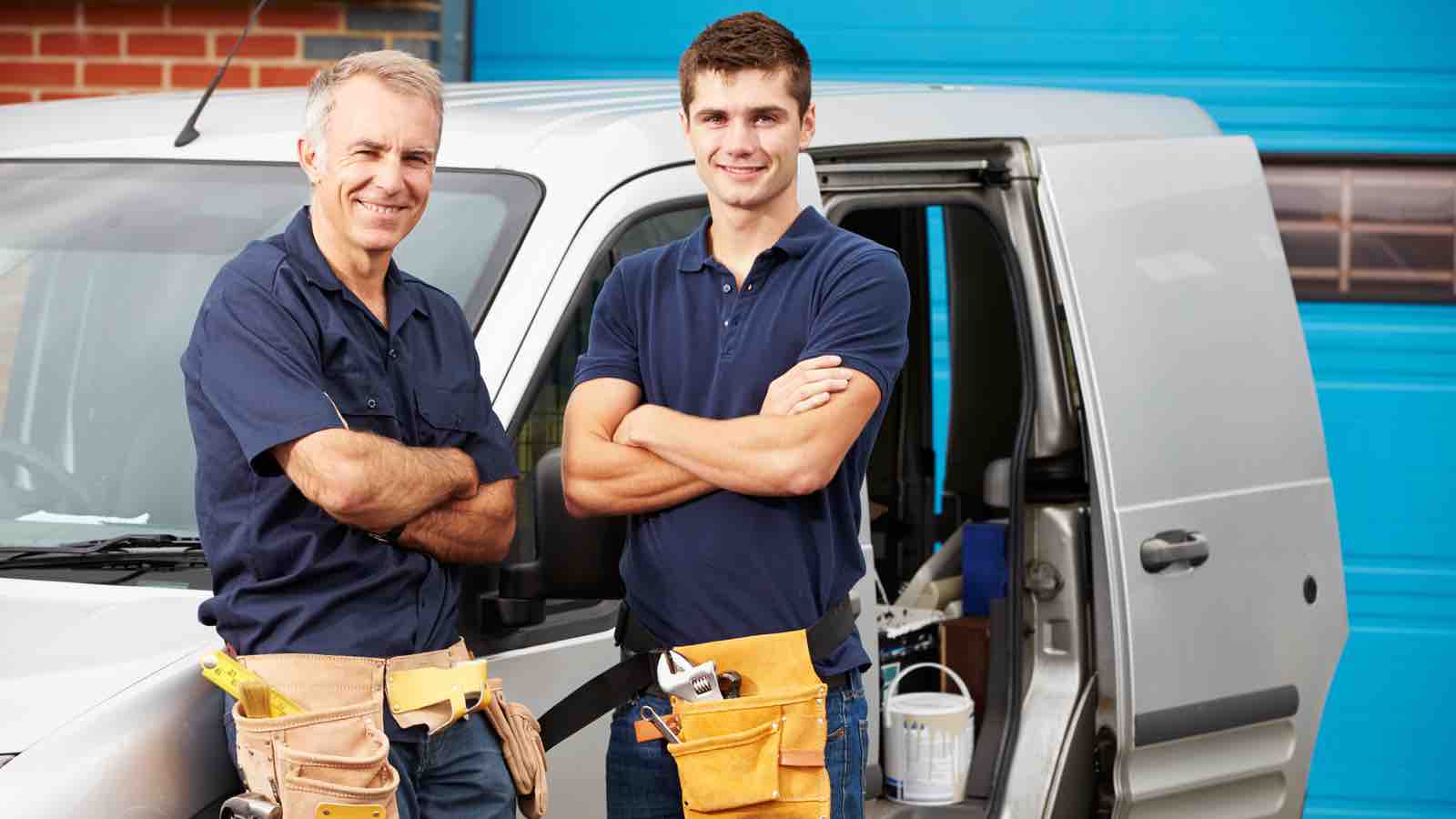 Contractor duo with a work van