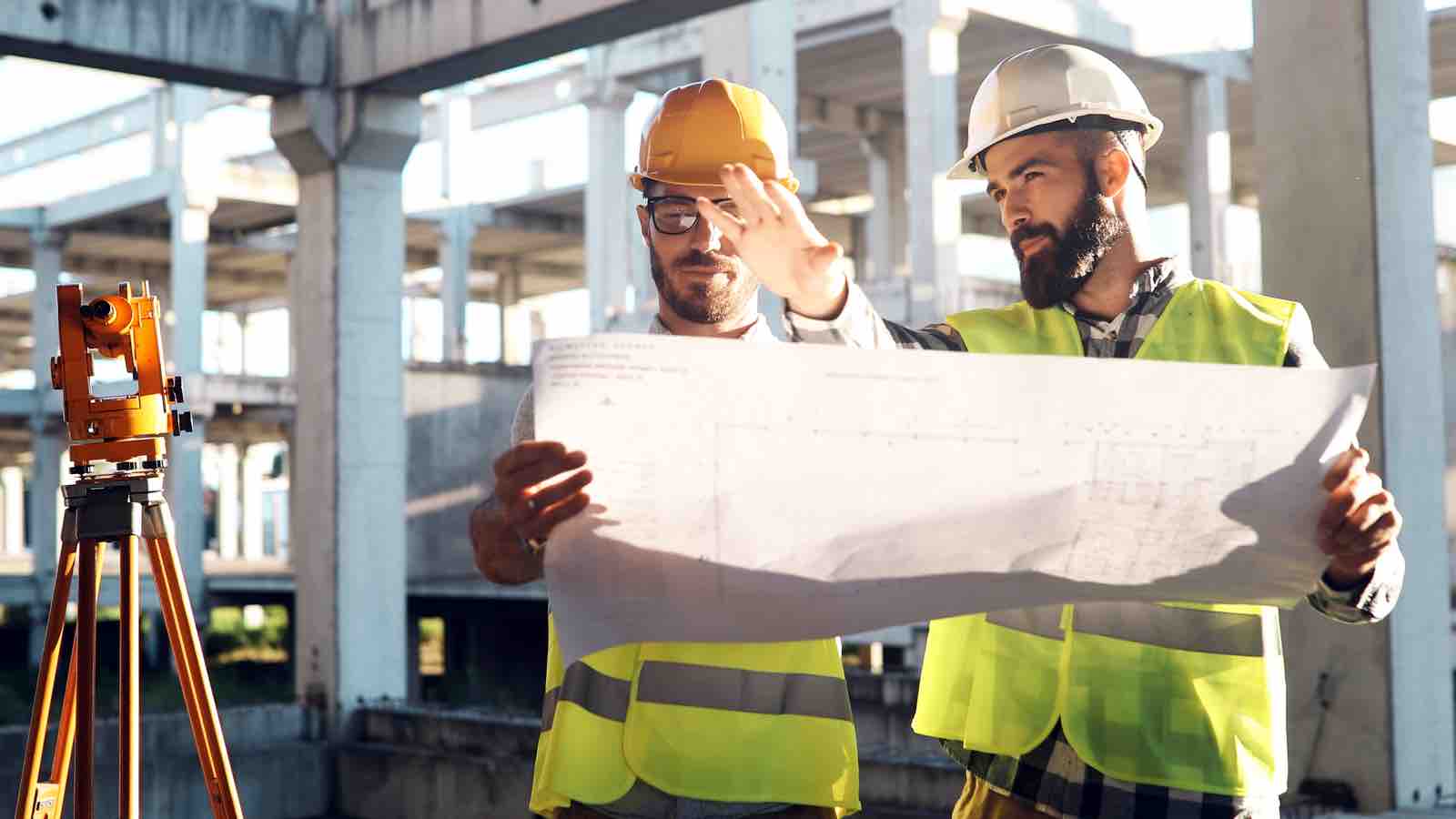 Contractors holding blueprints