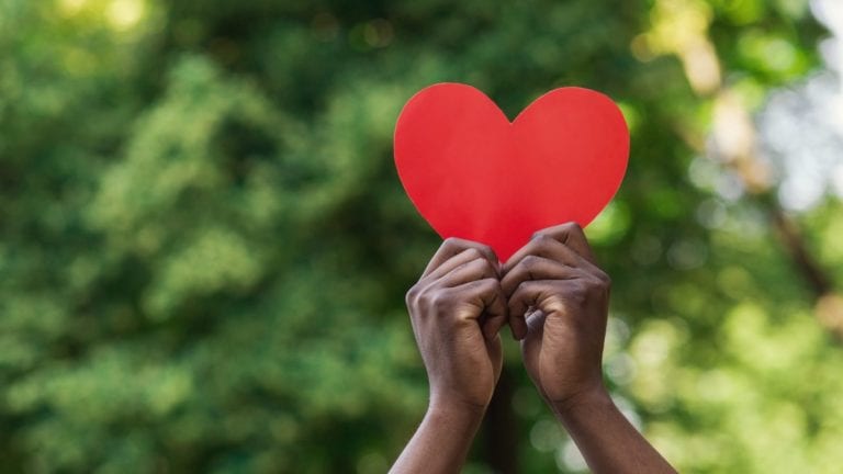 Hands holding a heart