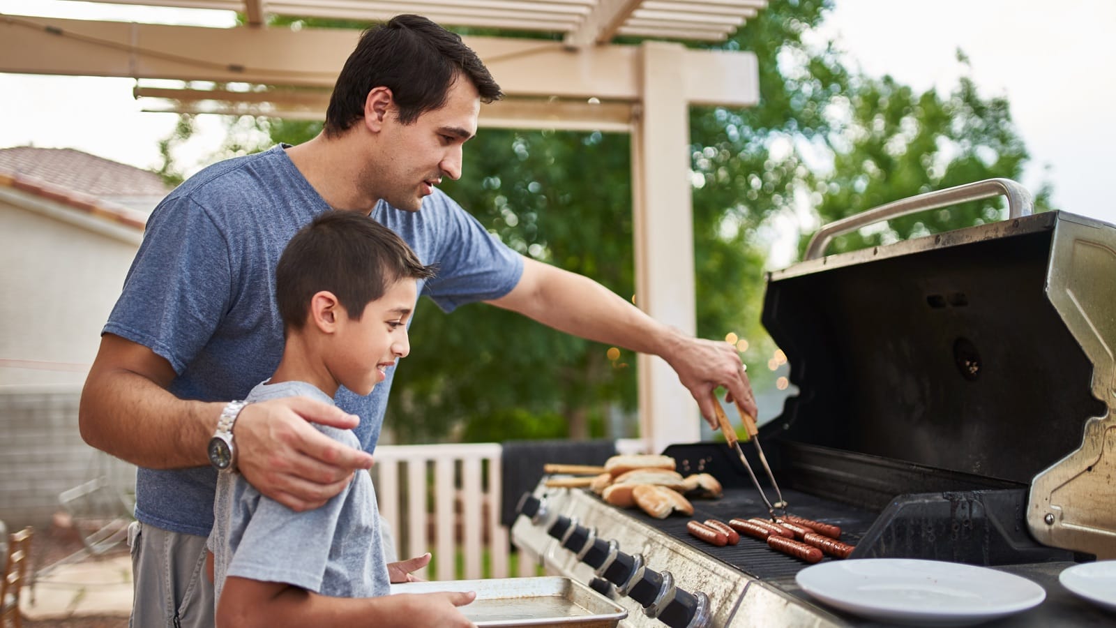 Father and son grilling