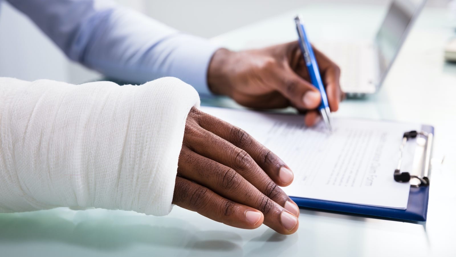 Injured hand signing forms