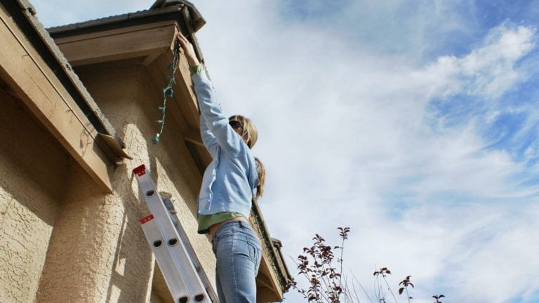 homeowner hanging lights