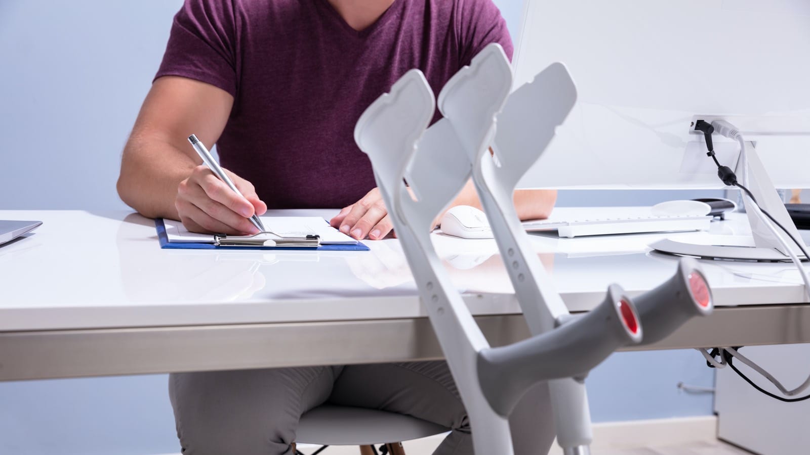 Injured man signing forms