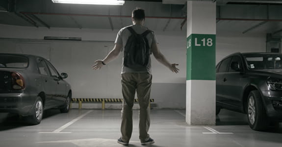 man_in_a_parking_garage_575x300