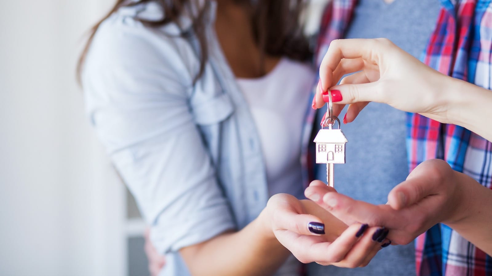 New homeowners receiving keys