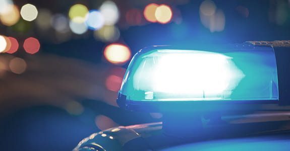 blue_light_on_top_of_cop_car_575x300