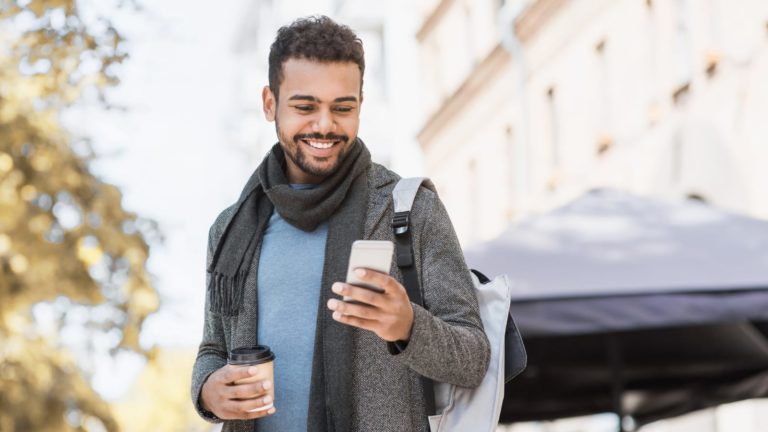 business owner walking outside in the fall