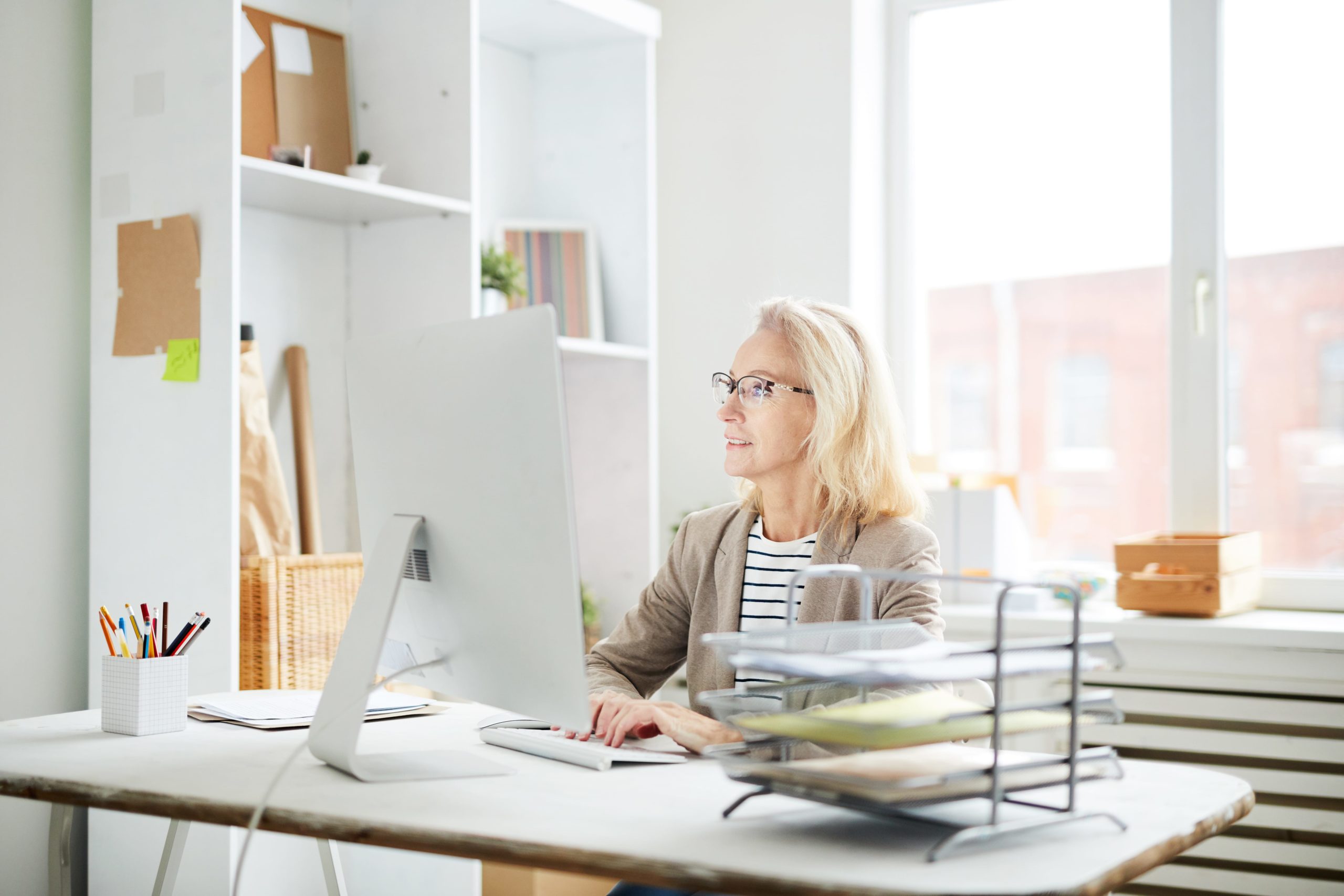 woman using computer at desk