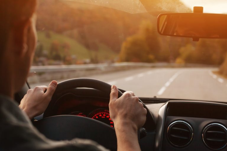 man driving on highway