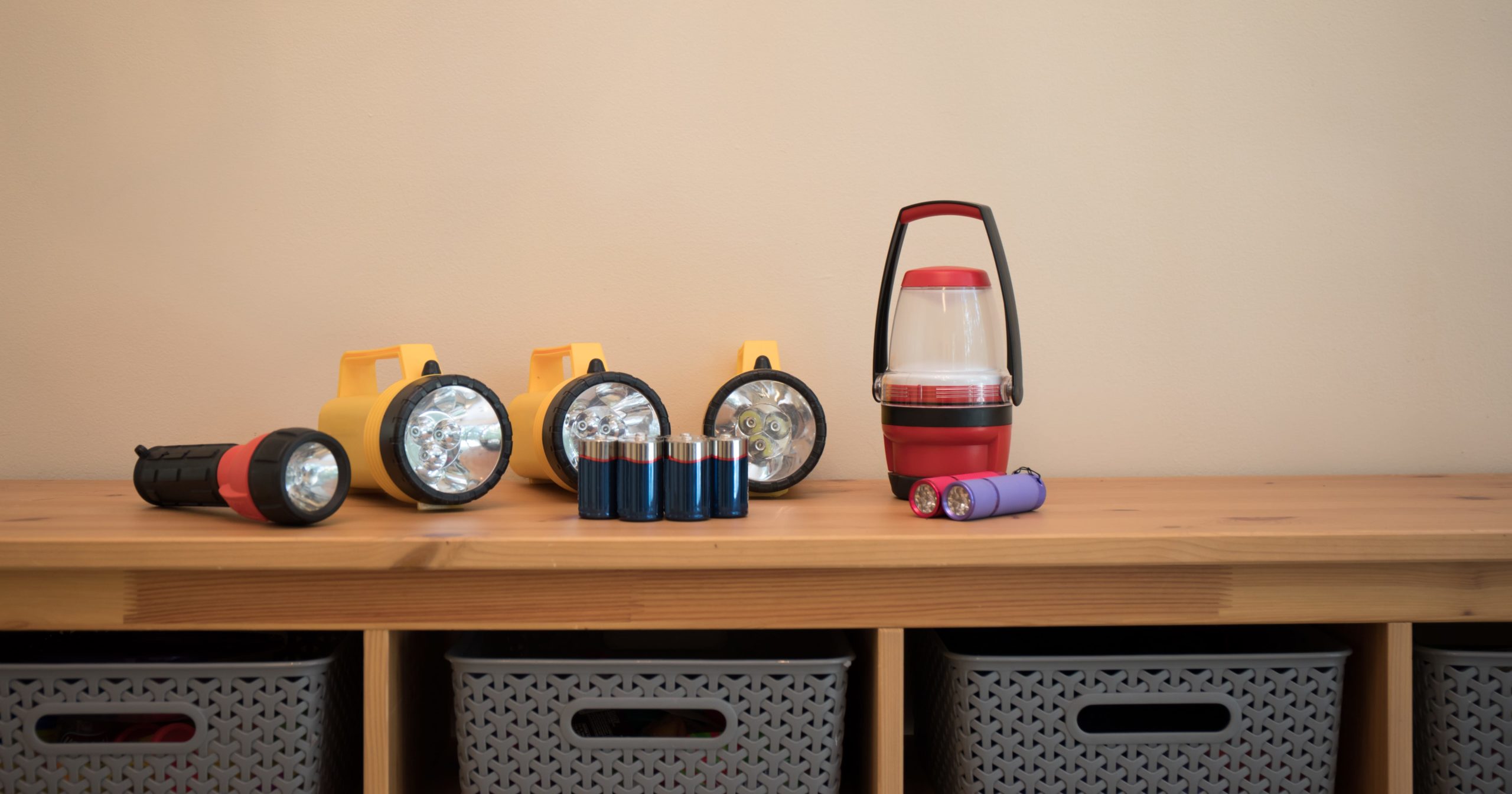 flashlights and batteries on a table