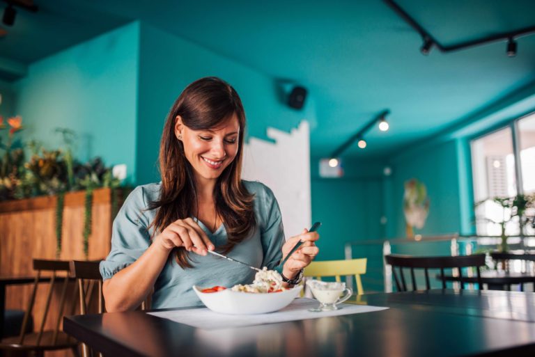 lady eating at restaurant