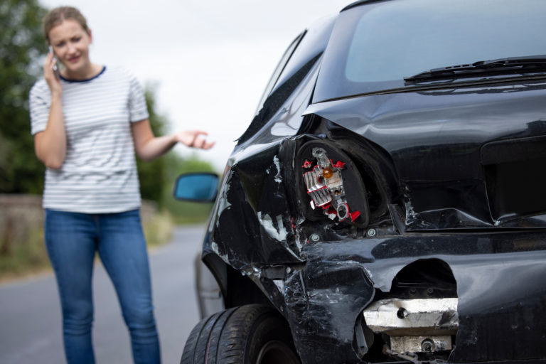 Woman Making Call After Car Accident