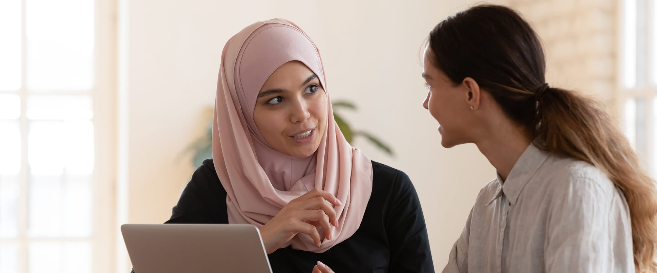 Two Young Women in Meeting