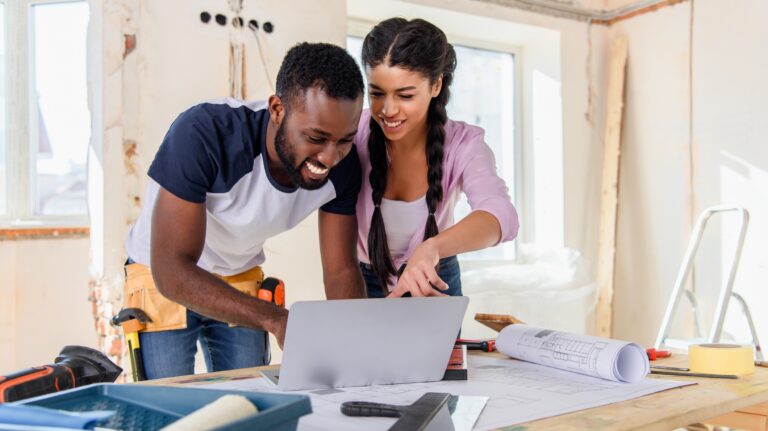 Young couple looking at laptop