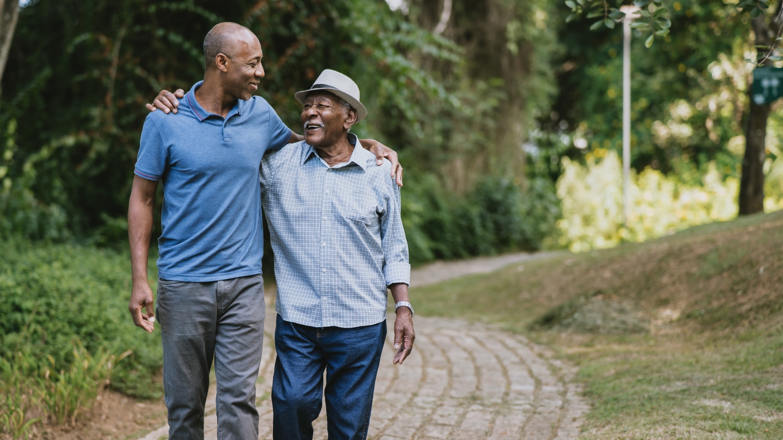 father and son walking on a stone path