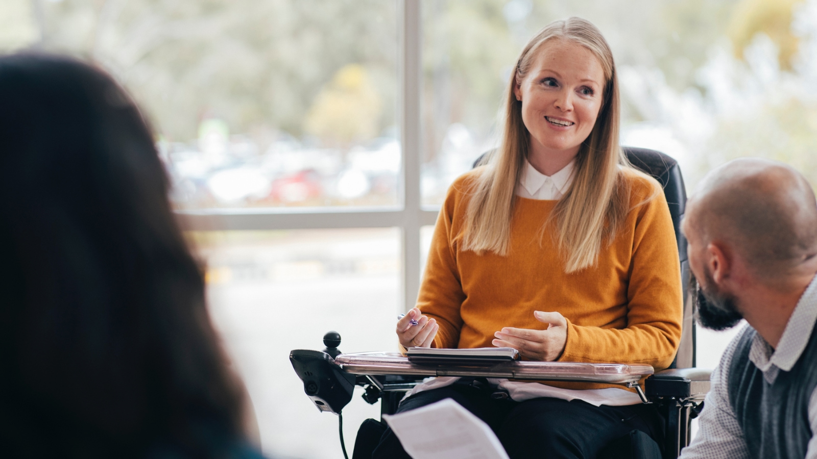 woman in wheelchair at work