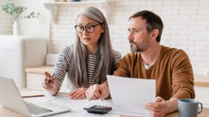 Couple looking at life insurance options.