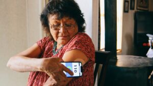 Elderly diabetic woman checking her blood sugar