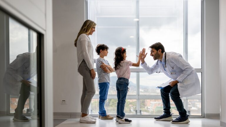 Mom with young children visiting doctor