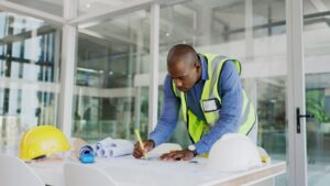 construction contractor working on blue print