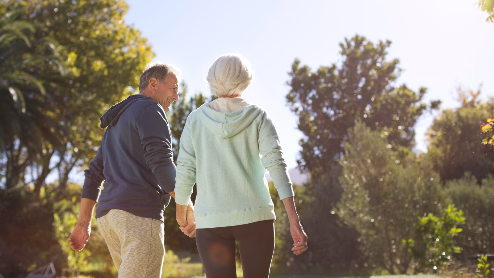 Senior couple taking walk outside together
