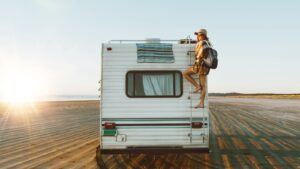 Woman climbing back of RV