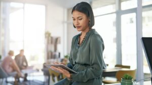 Young woman reading on ipad