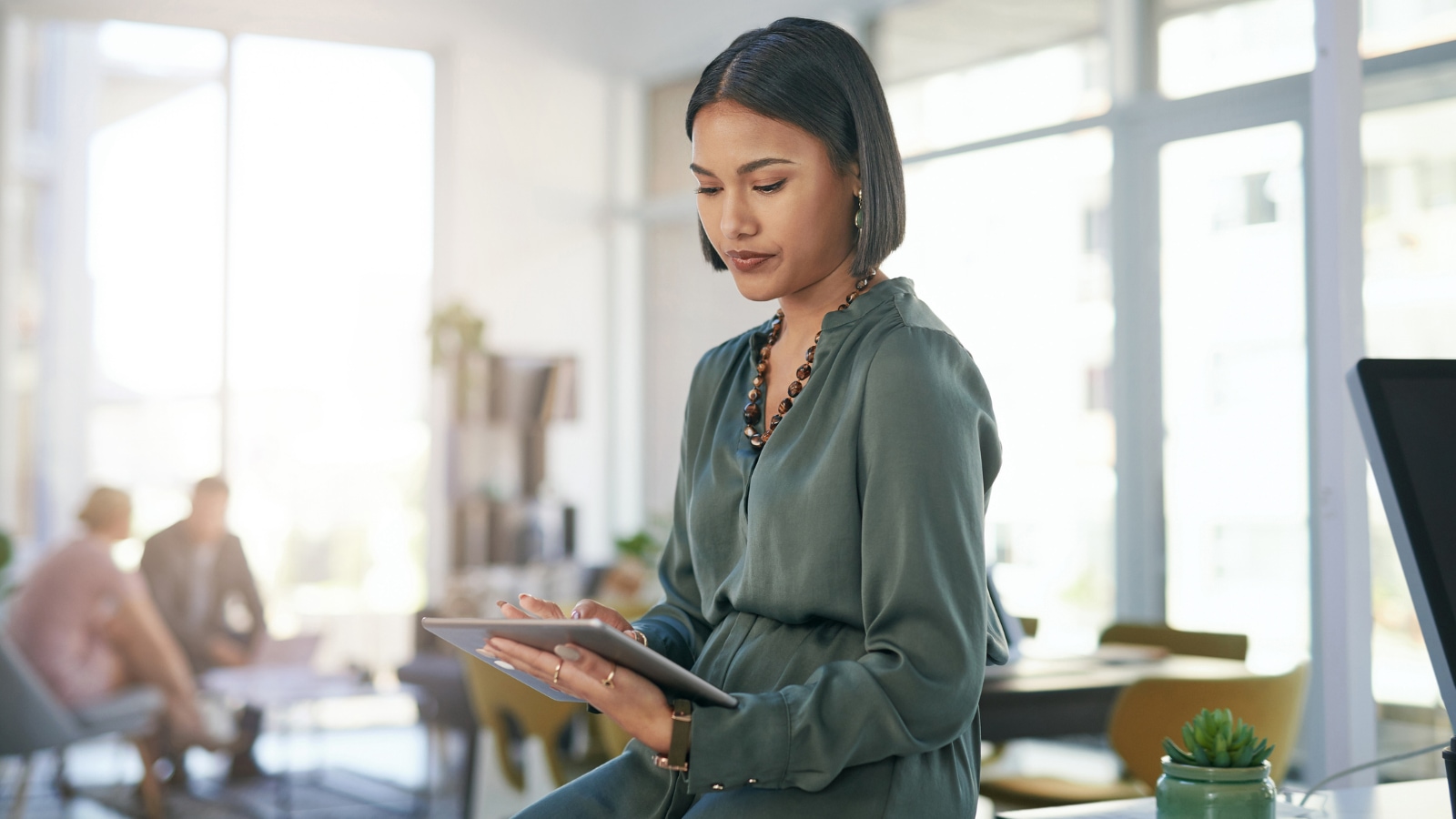 Young woman reading on ipad